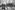 Ronald Reagen, Präsident der USA (4.v.r.), auf einer Bühne vor dem Brandenburger Tor (v.r.: Hannelore Kohl; Nancy Reagan; Eberhard Diepgen, Regierender Bürgermeister von Berlin; ab 2.v.l.: Philipp Jenninger, Präsident des Deutschen Bundestages; Bundeskanzler Helmut Kohl).